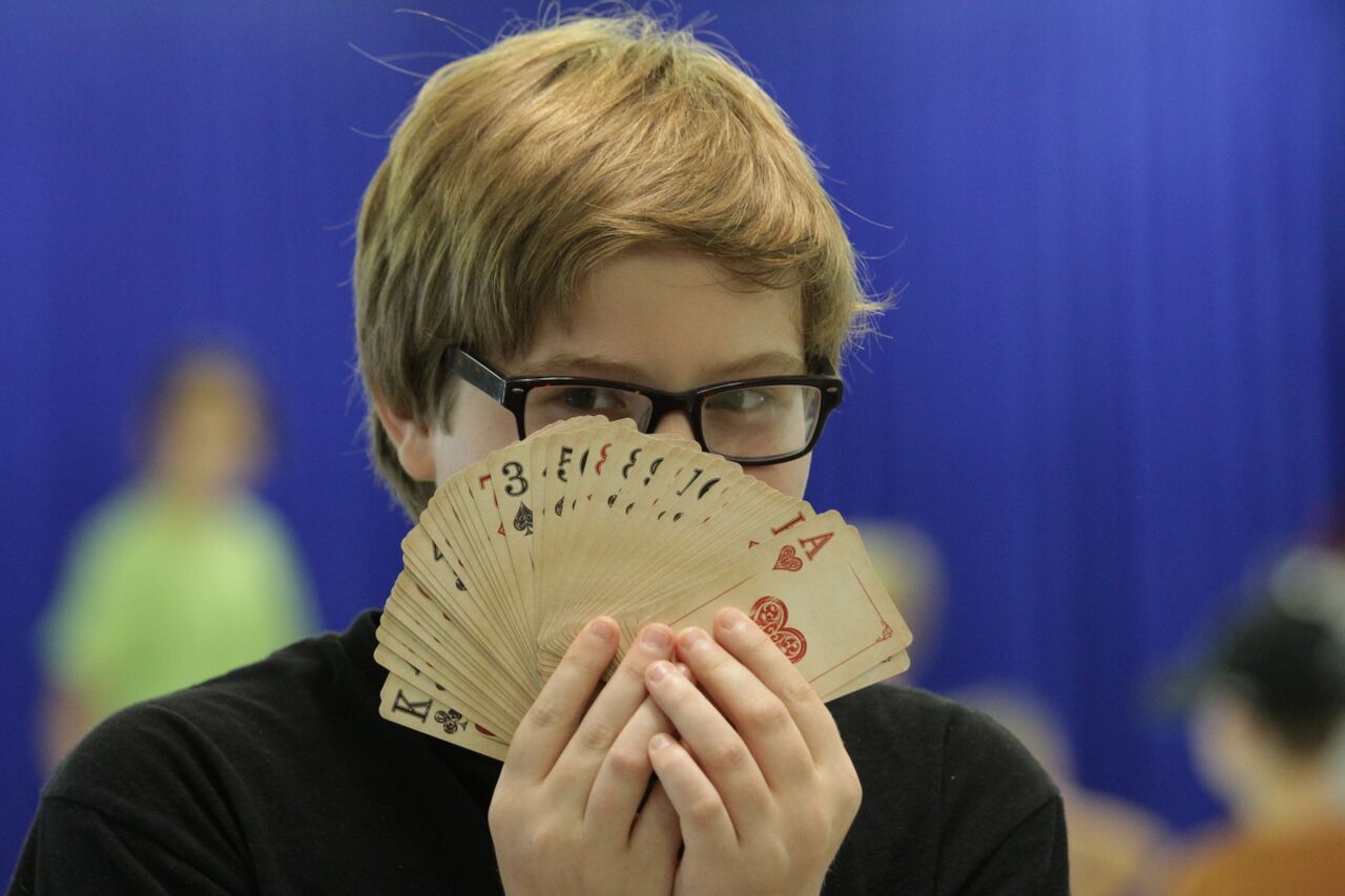 Magic card trick being performed at Oklahoma library workshop